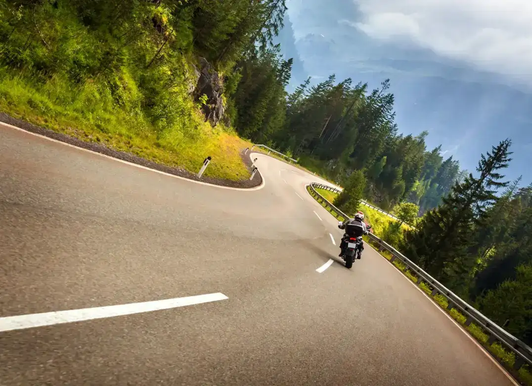 Motorcycle riding on a winding road
